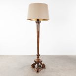 A wood sculptured standing lamp, circa 1920. (L:42 x W:42 x H:188 cm)