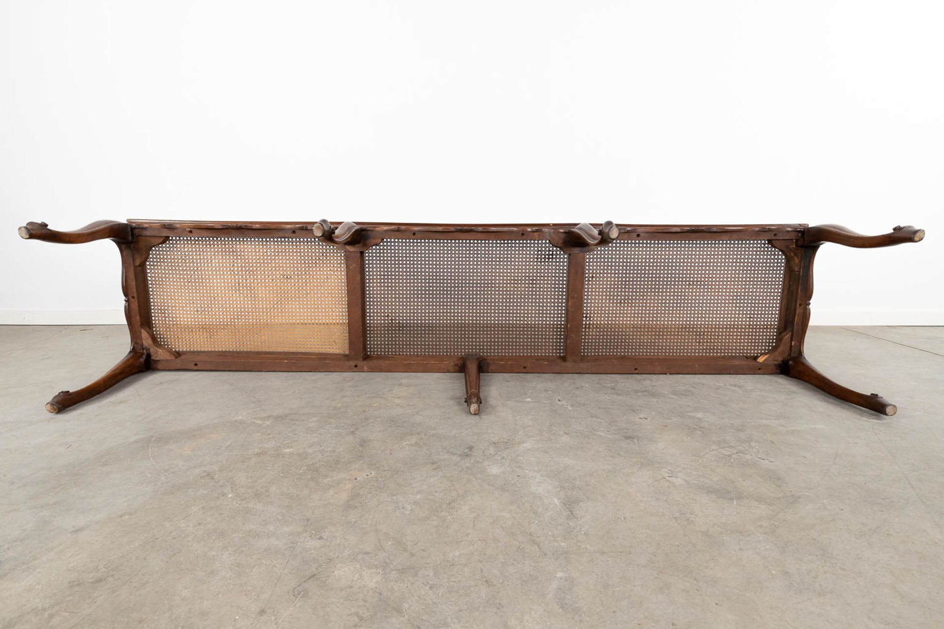A long bench made of sculptured wood in Louis XV style finished with caning. (L:48 x W:218 x H:44 c - Image 13 of 13