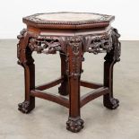 An Oriental octagonal stand, hardwood and finished with a marble top. (L:41 x W:41 x H:48 cm)