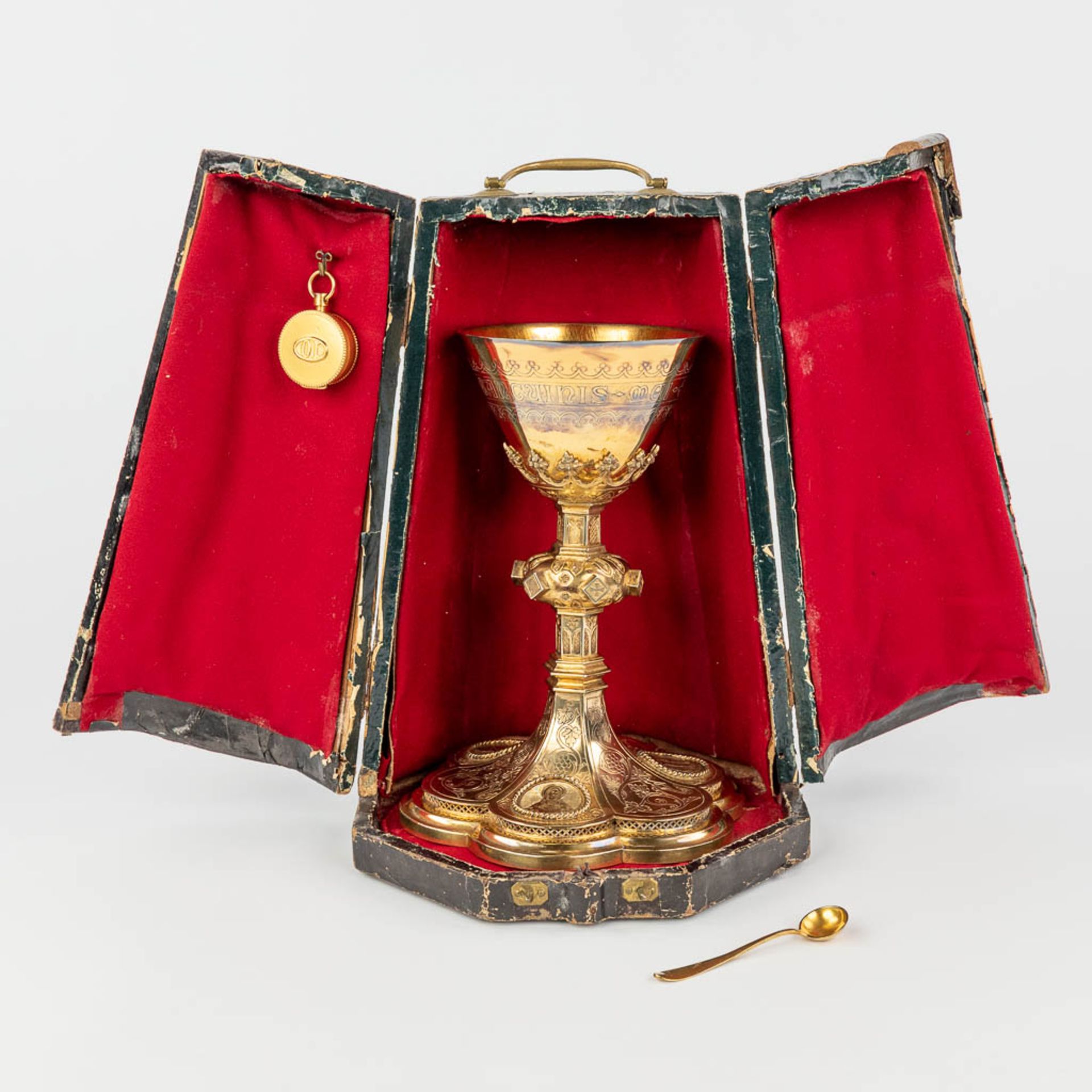 A gothic revival chalice with paten, spoon and sacramental bread box in the original box. (H:22,5 x