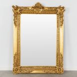 A gold-plated mirror, made of wood an stucco. 20th C. (W:104 x H:145 cm)