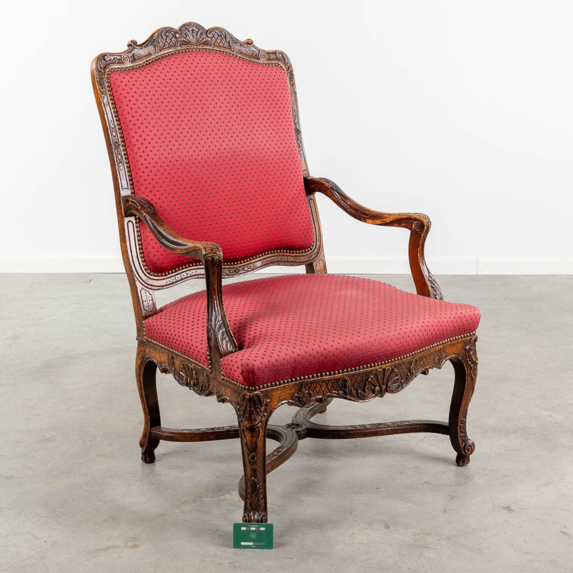 An armchair finished with red fabric and wood sculptures in Louis XV style. (L:73 x W:72 x H:108 cm - Image 2 of 13