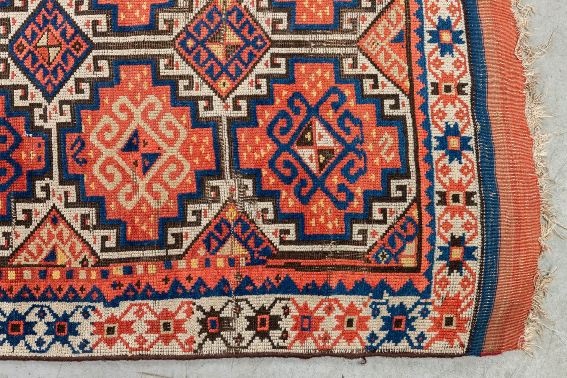 An oriental hand-made carpet. Kazak Caucasian. (L:315 x W:104 cm) - Image 7 of 9