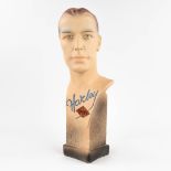 Novita, a men's bust 'Harley Sport', moulded and polychrome plaster. (L:18,5 x W:20 x H:58 cm)