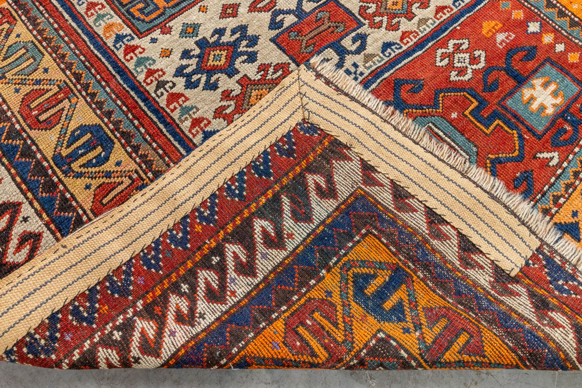An oriental hand-made carpet. Kazak Caucasian. (L:175 x W:122 cm) - Image 6 of 9
