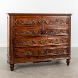 An antique commode with 4 drawers, decorated with mythological figurines and mounted with bronze. Lo