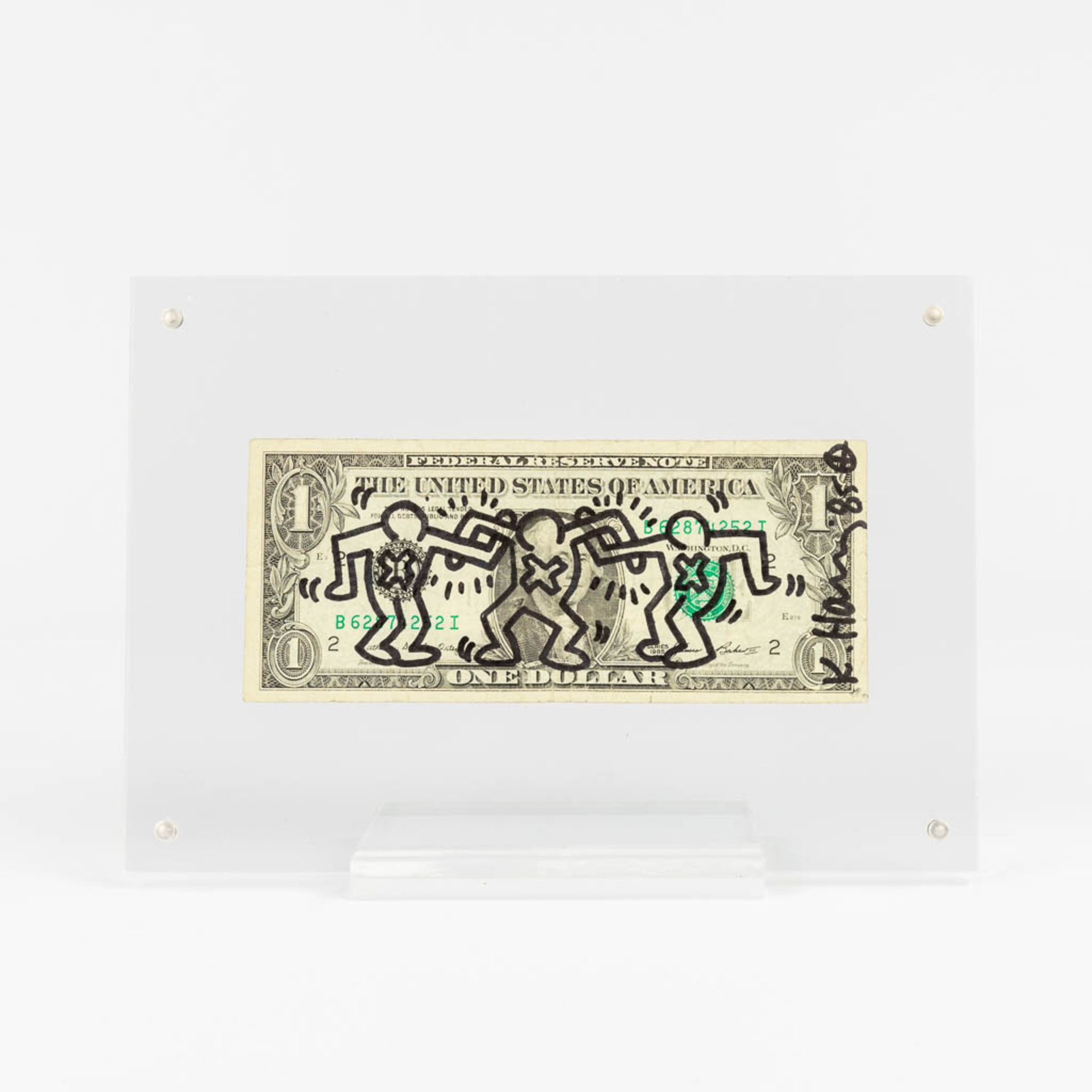 Keith HARING (1958-1990)(attr.) a signed 1 dollar bill (1985) (L:15,5 x W:6,5 cm)