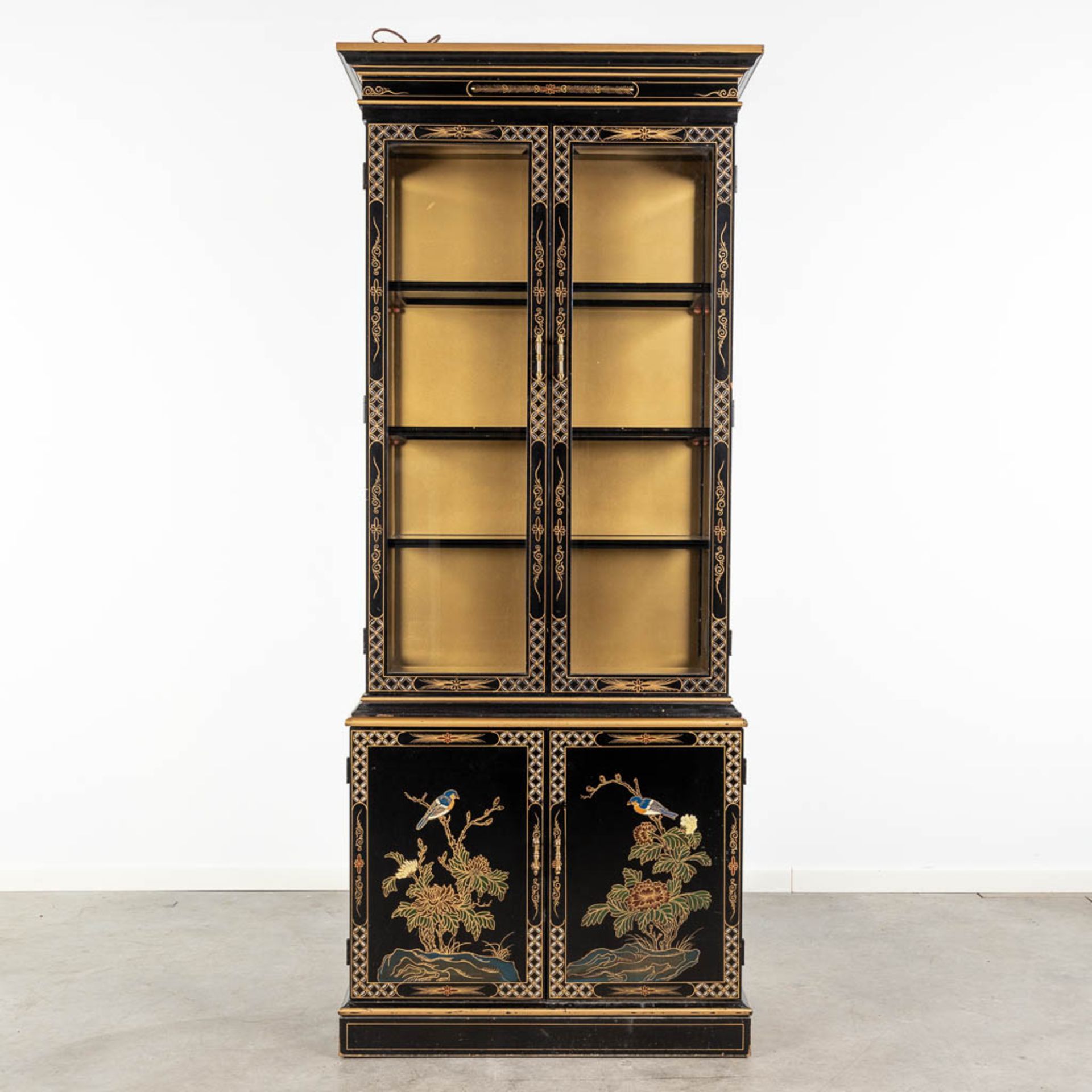 A display cabinet decorated with Oriental decors and birds. 20th C. (L:44 x W:84 x H:203 cm)
