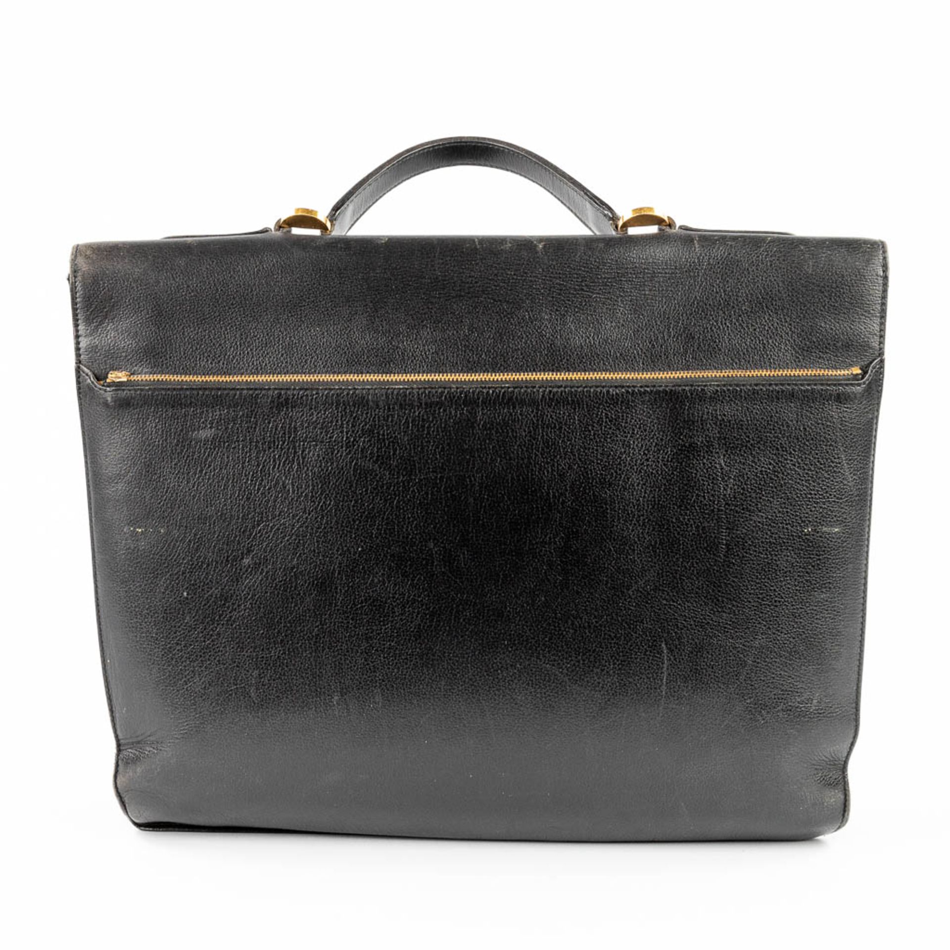 Delvaux, a suitcase made of black leather with gold-plated elements. (W:39 x H:33 cm) - Image 6 of 16