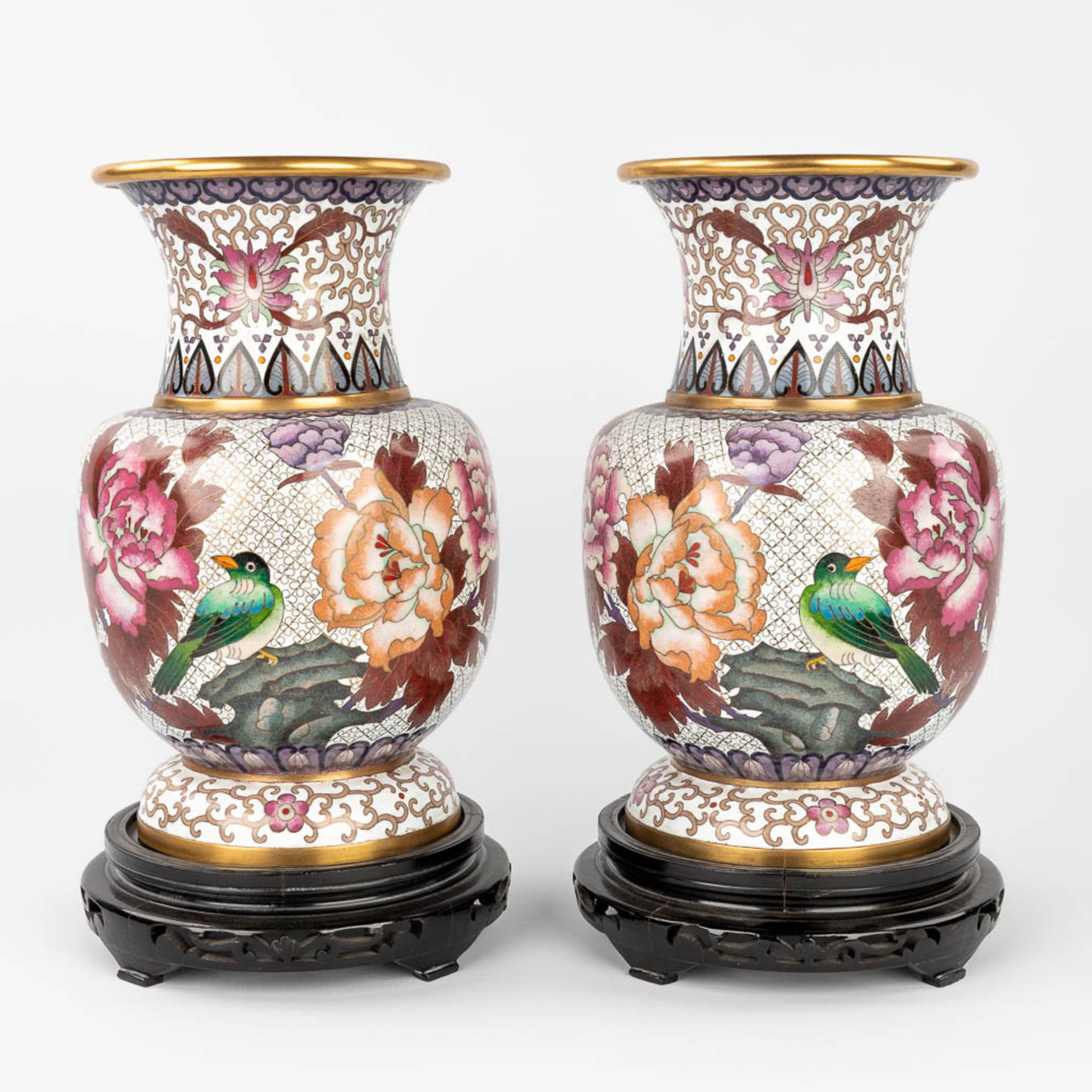 A pair of cloisonnŽ vases with flower and bird decor, in the original box. (H:31 x D:19 cm) (H:31