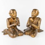 A set of 2 Thai buddha's, made of sculptured wood (L:51 x W:38 x H:47 cm)