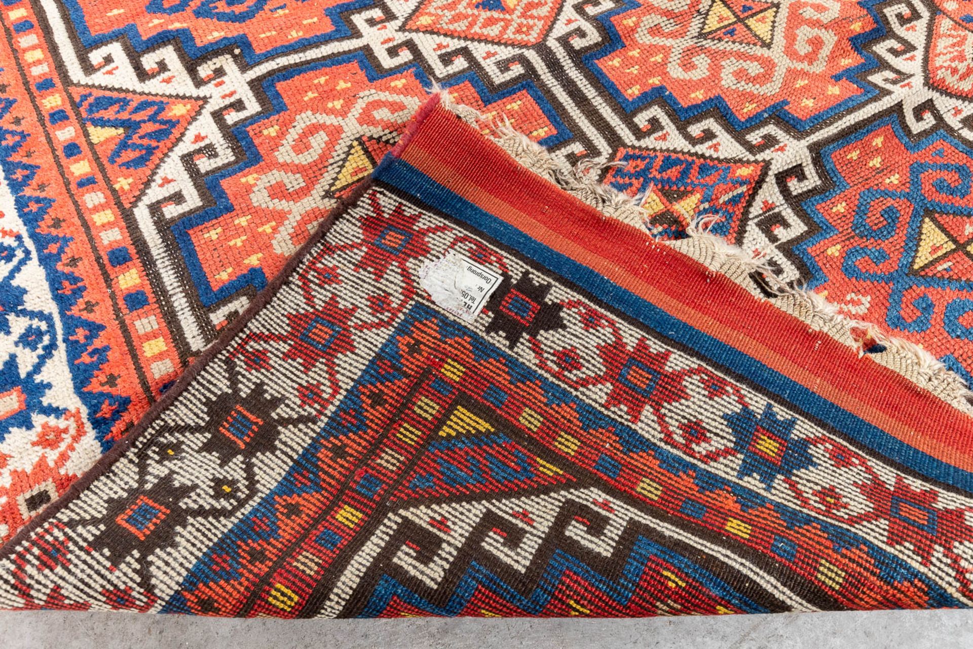 An oriental hand-made carpet. Kazak Caucasian. (L:315 x W:104 cm) - Image 8 of 9