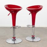A pair of bar stools with a red seat. (H:88 x D:40 cm)