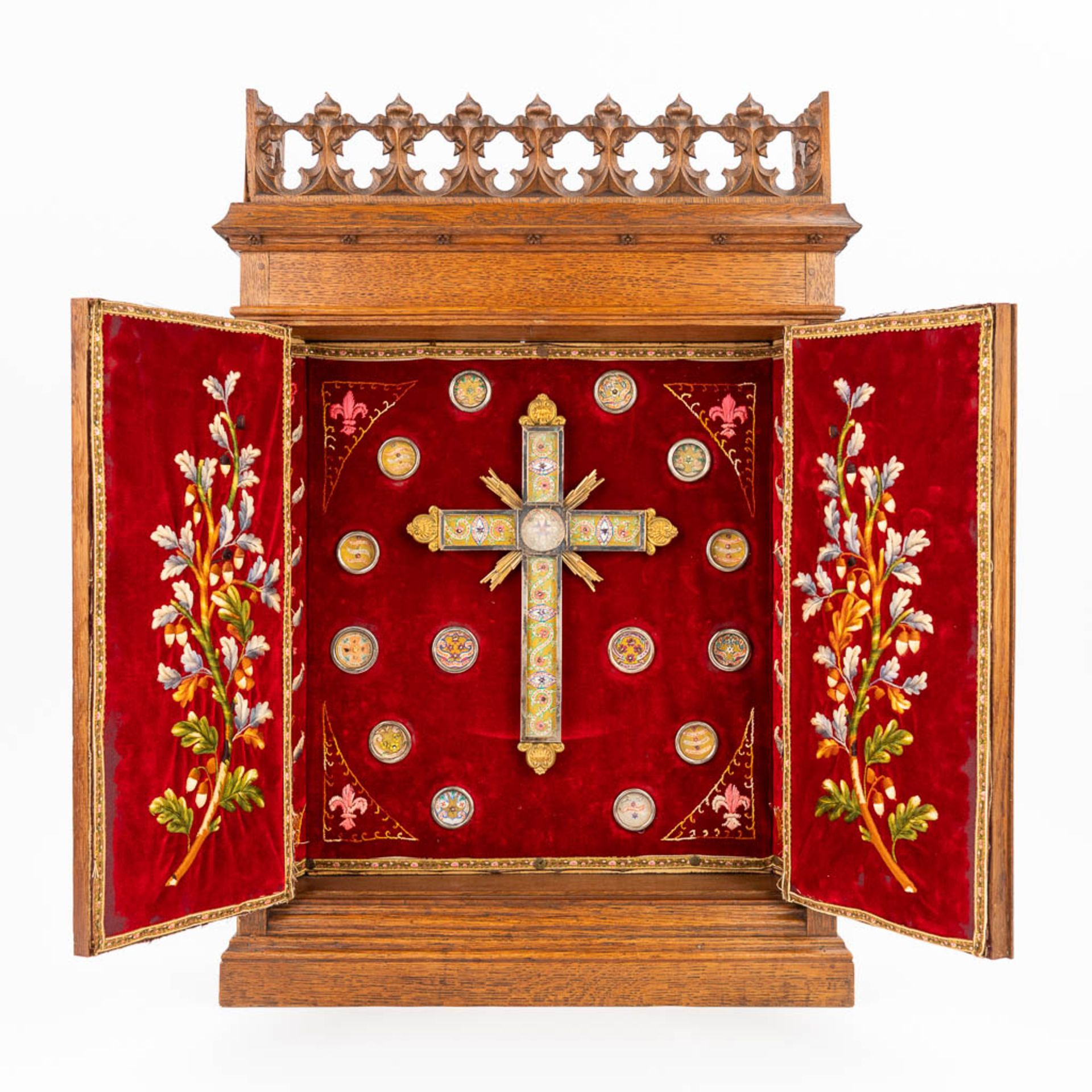 An antique reliquary box with relics a relic crucifix and embroidery. (L:13 x W:52 x H:75 cm)