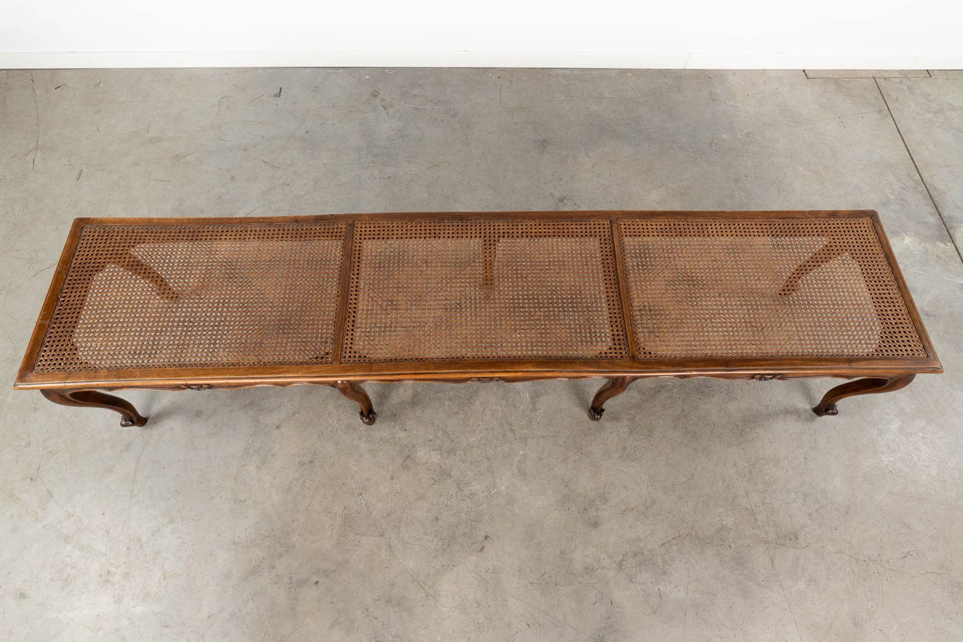 A long bench made of sculptured wood in Louis XV style finished with caning. (L:48 x W:218 x H:44 c - Image 9 of 13