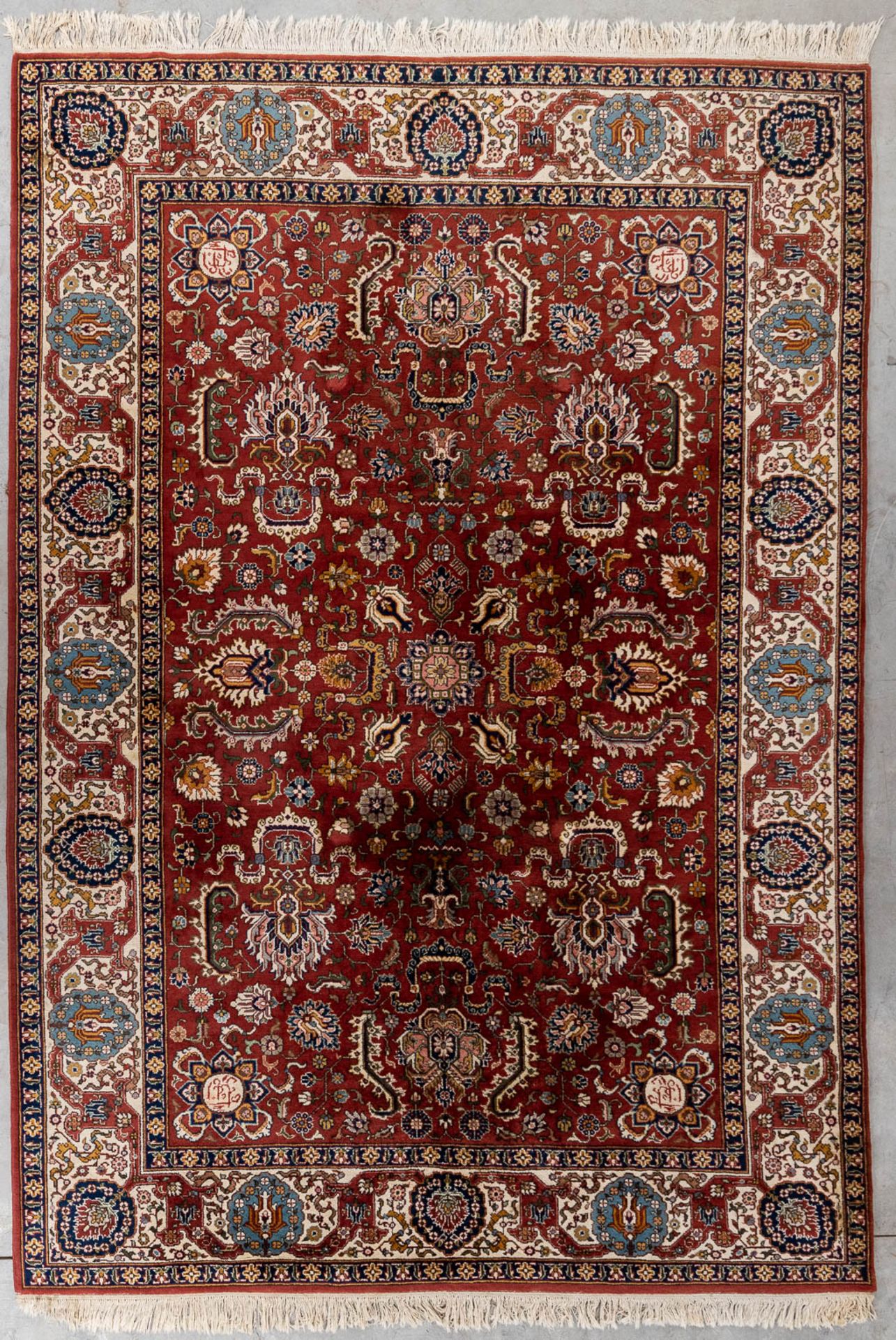 An Oriental hand-made carpet, Heriz. (L:360 x W:250 cm)