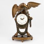 An antique wood sculptured mantle clock with an eagle figurine. 19th C. (L:22 x W:52 x H:73 cm)