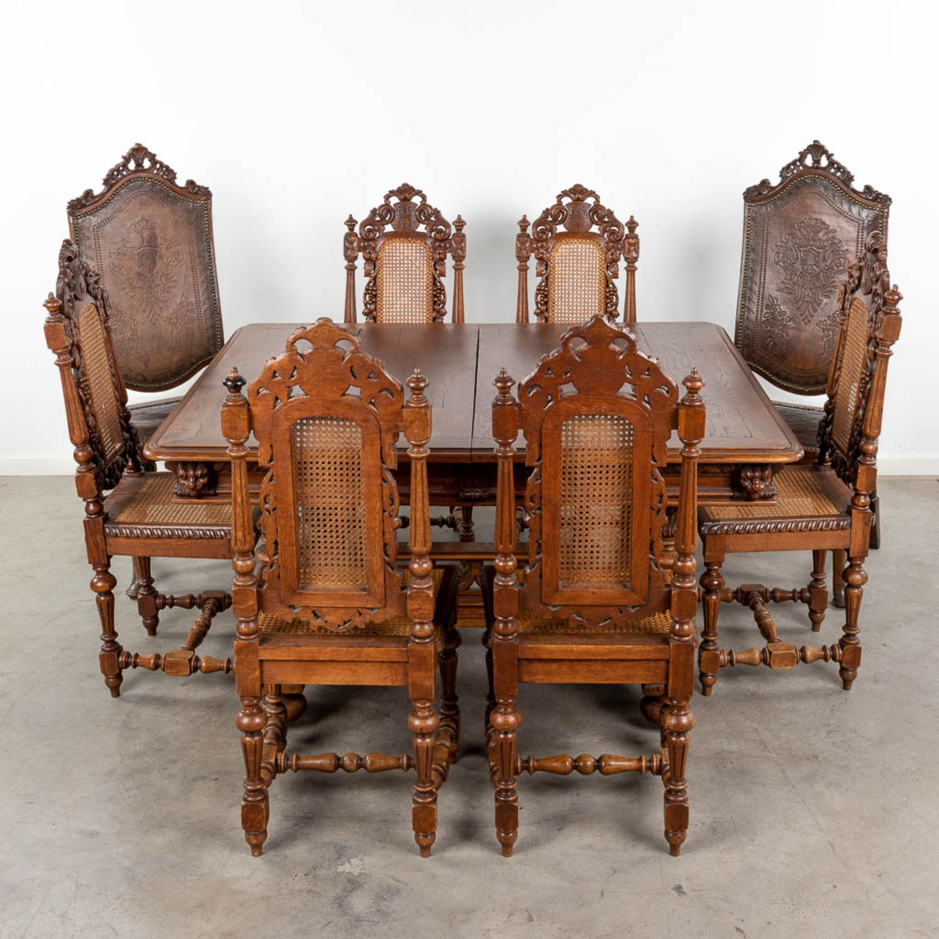 An antique table with 6 chairs in renaissance style. (L:120 x W:142 x H:72 cm)