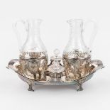 An antique oil and vinegar set, made of cut crystal and silver. Circa 1850. (L:26 x W:16 x H:21 cm)