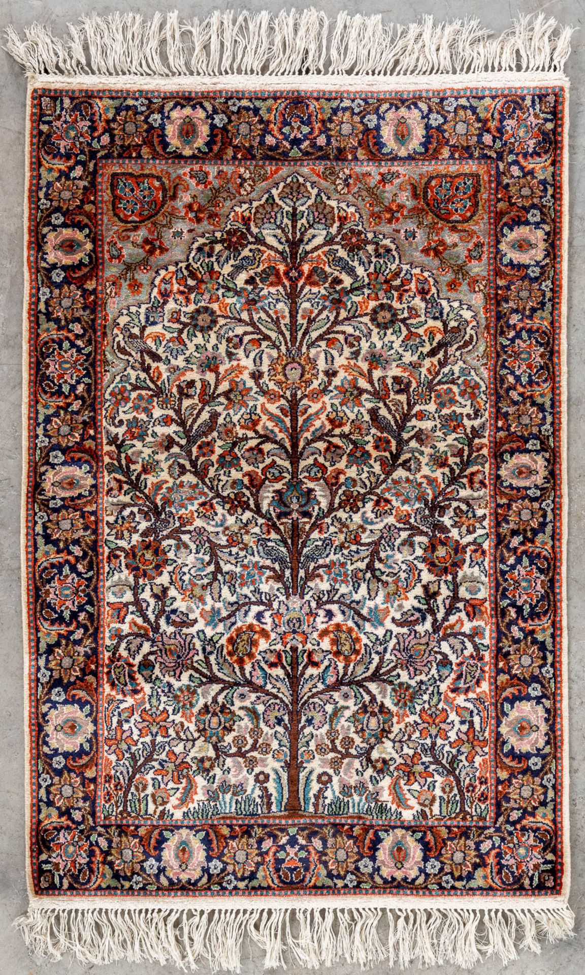 An oriental hand-made carpet made of silk, 'Tree Of Life', Kashmir. (L:60 x W:90 cm)