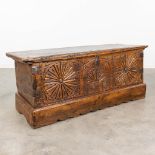 An antique chest, made of sculptured wood panels. (L:48 x W:136 x H:55 cm)