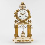 A column mantle clock made of marble mounted with bronze in Louis XVI style. 19th C. (L:14 x W:25 x