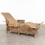 A decorative lounge chair, made of rotan. Probably made in France, circa 1930. (L:87 x W:200 x H:95