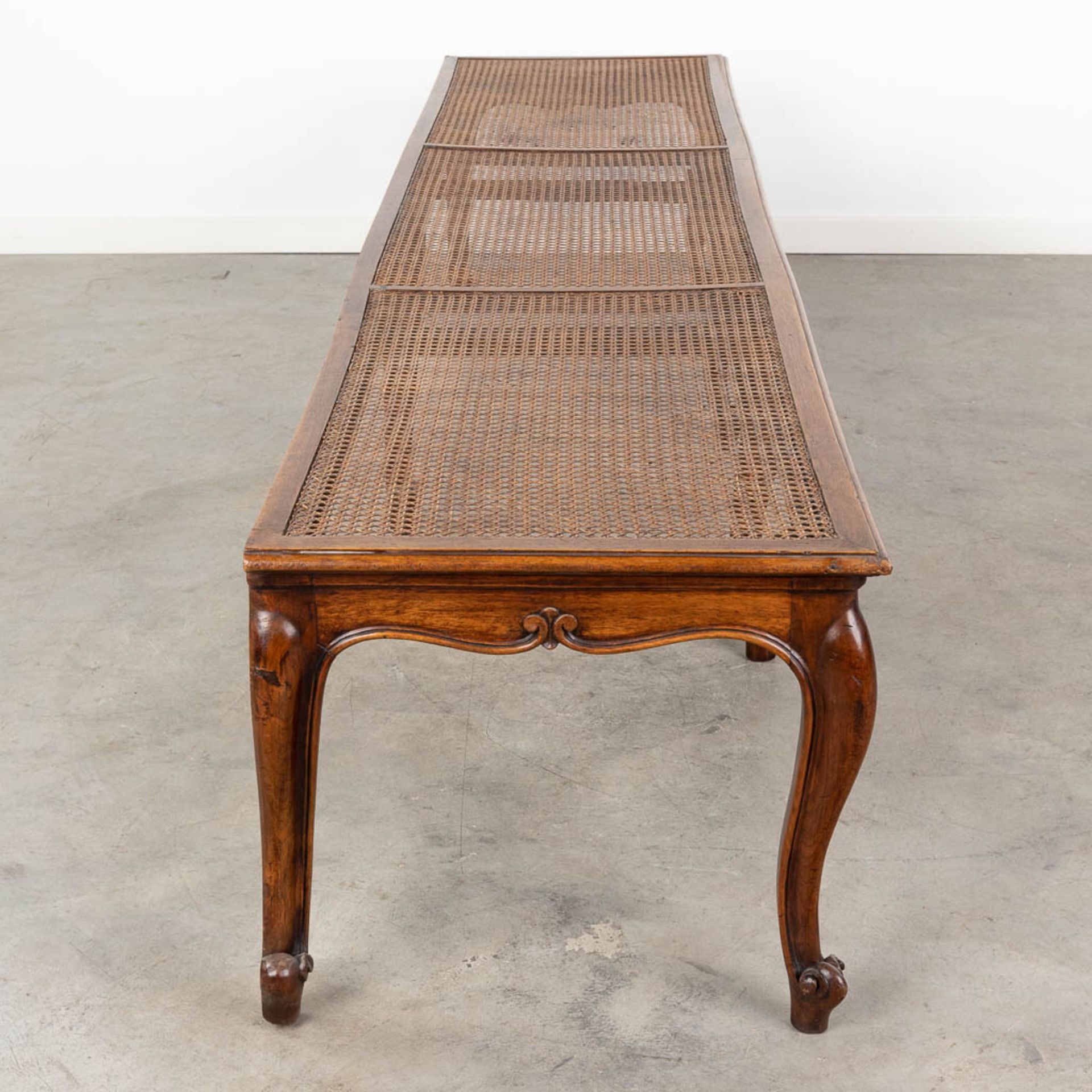 A long bench made of sculptured wood in Louis XV style finished with caning. (L:48 x W:218 x H:44 c - Image 4 of 13
