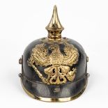 An antique German 'Pickelhaube' decorated with an eagle. Dating 1914-1918. (L:25 x W:18 x H:21 cm)