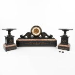 A three-piece mantle garniture clock and side pieces made of black marble. (W:63 x H:34 cm)