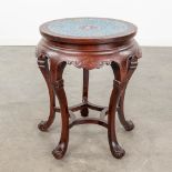 An Oriental stand, hardwood and finished with a cloisonnŽ top. (H:51 x D:45 cm)