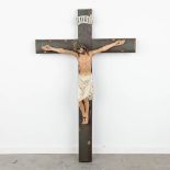 A large Corpus Christi made of plaster and mounted on a wood sculptured crucifix. (W:85 x H:130 cm)