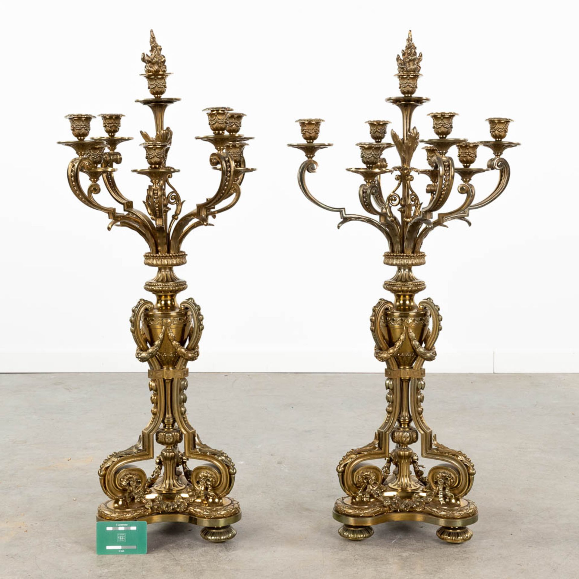 A pair of large neoclassical candelabra made of polished bronze. (L:30 x W:30 x H:90 x D:42,5 cm) - Image 2 of 12