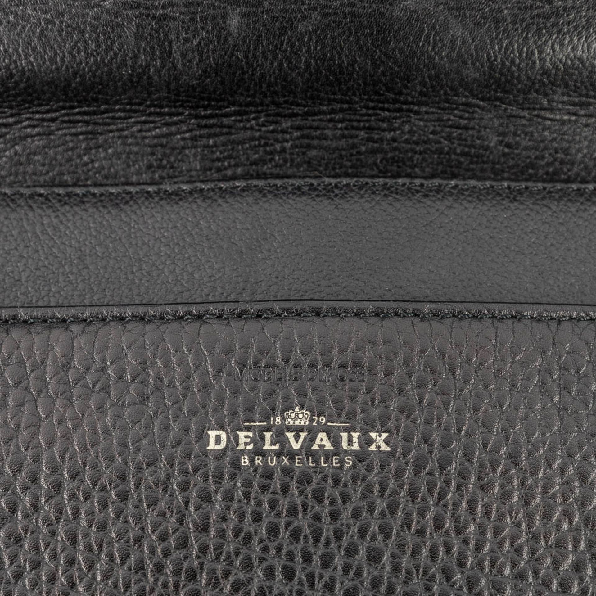 Delvaux, a suitcase made of black leather with gold-plated elements. (W:39 x H:33 cm) - Image 12 of 16