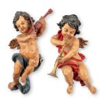 A pair of decorative musical angels, made of resine. (W:30 x H:58 cm)