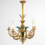 A chandelier made of bronze in empire style, decorated with eagle heads. Circa 1970. (H:85 x D:59 c