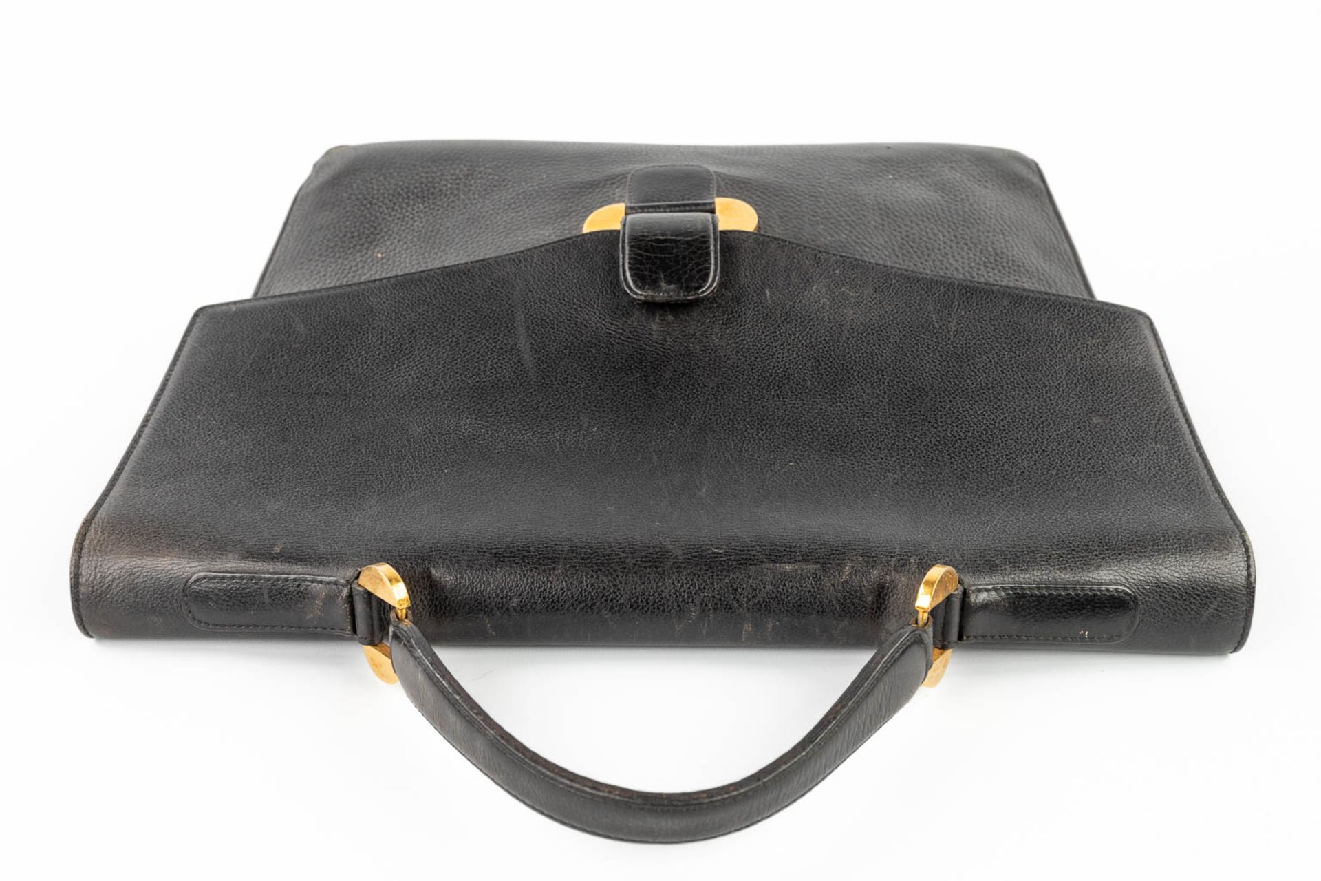 Delvaux, a suitcase made of black leather with gold-plated elements. (W:39 x H:33 cm) - Image 15 of 16