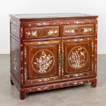 An Oriental commode decorated with mother of pearl inlay. (L:50 x W:92 x H:84 cm)