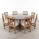 McGuire Furniture company, a large round dining room table with 8 chairs. (H:73 x D:180 cm)