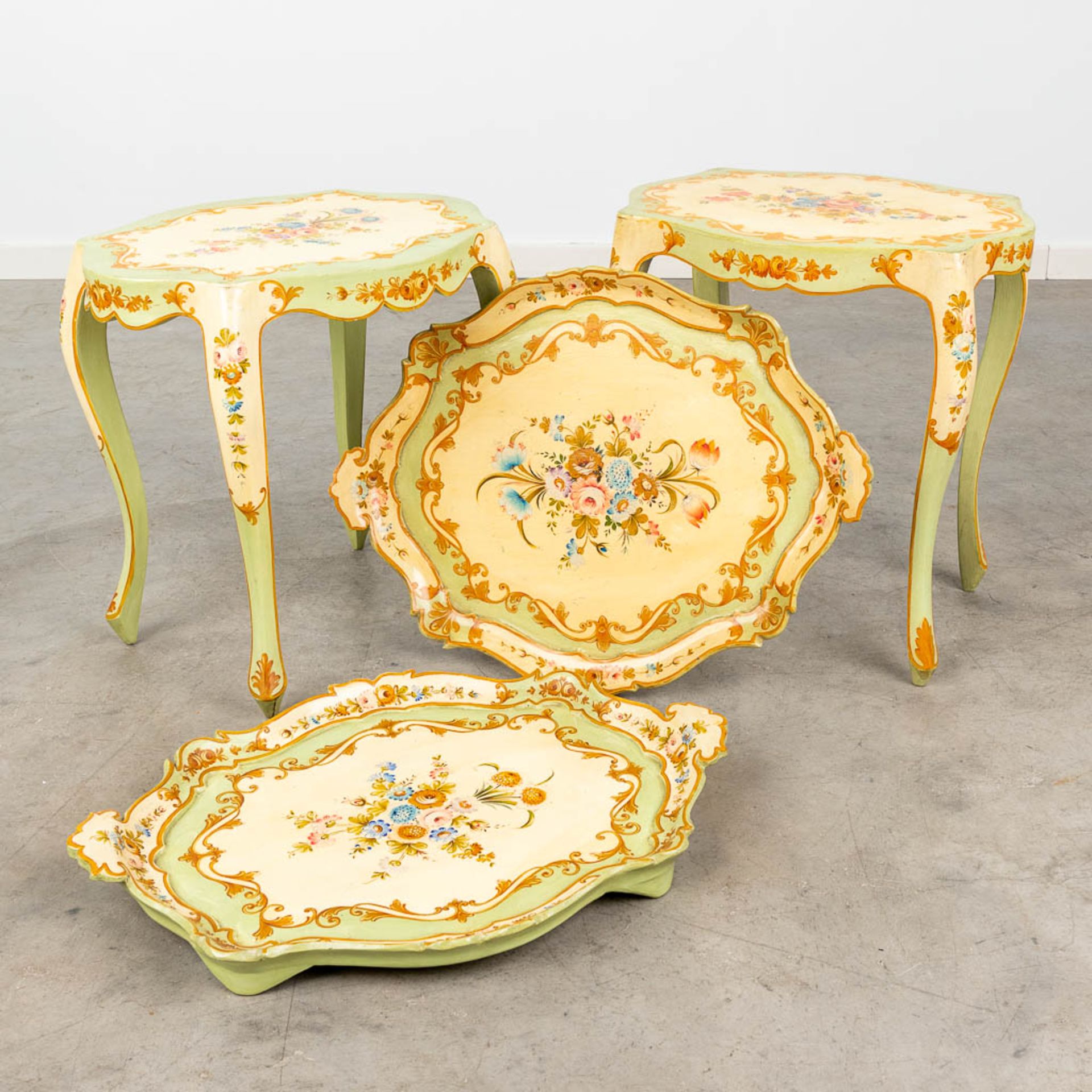 A pair of side tables with removable serving tray, decorated with hand-painted flowers. Italy, circa