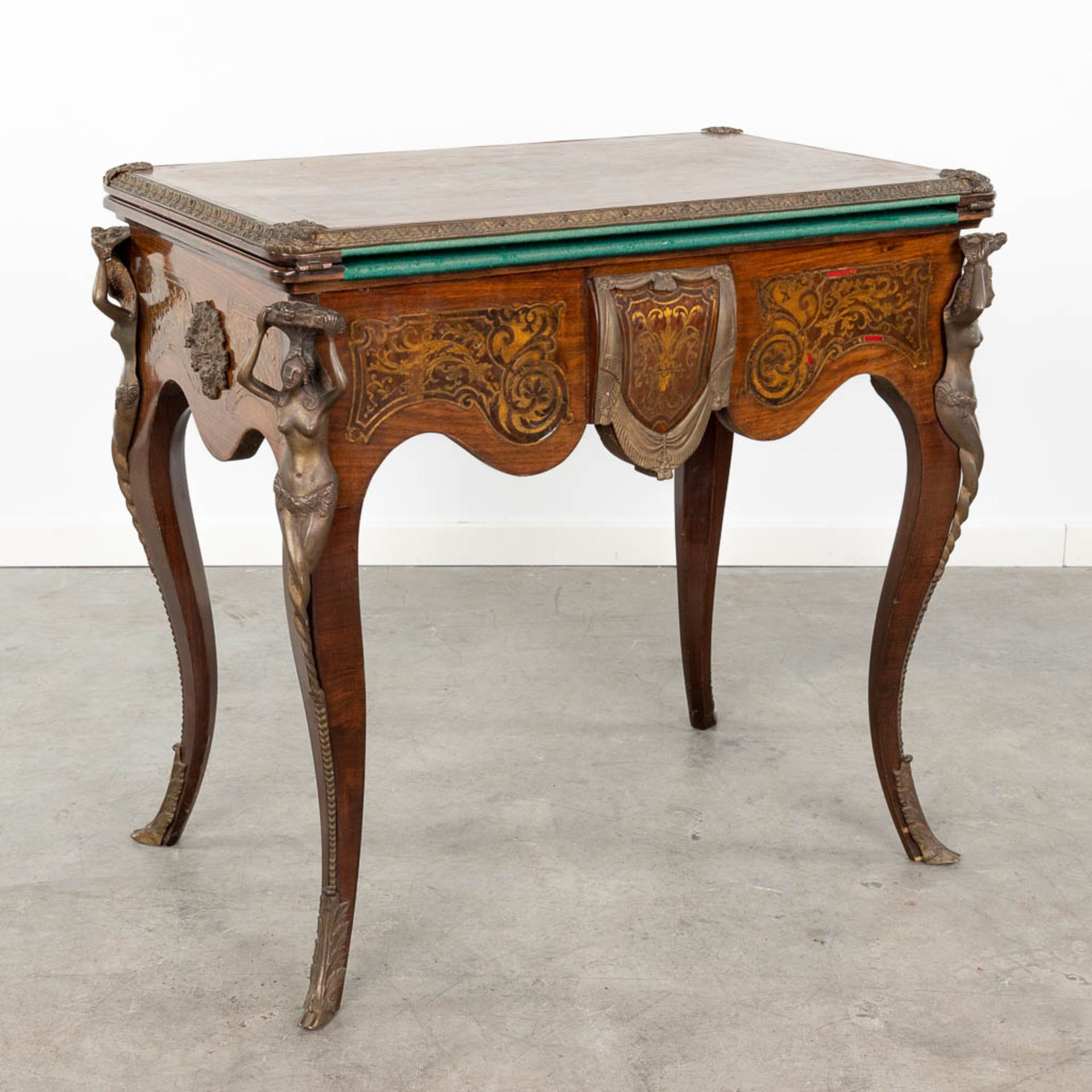 A game table inlaid in the style of boulle/Napoleon 3 mounted with bronze. Circa 1970. (L:52 x W:80