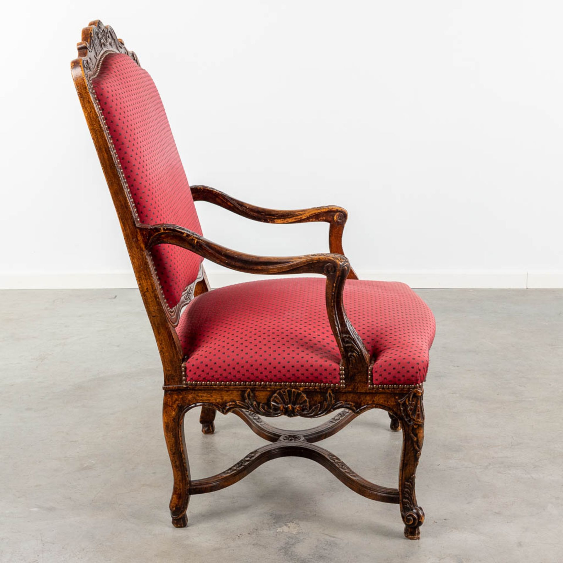 An armchair finished with red fabric and wood sculptures in Louis XV style. (L:73 x W:72 x H:108 cm - Image 3 of 13