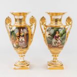 A pair of decorative urns 'Porcelaine de Paris', empire style with a hand-painted decor. 19th centur