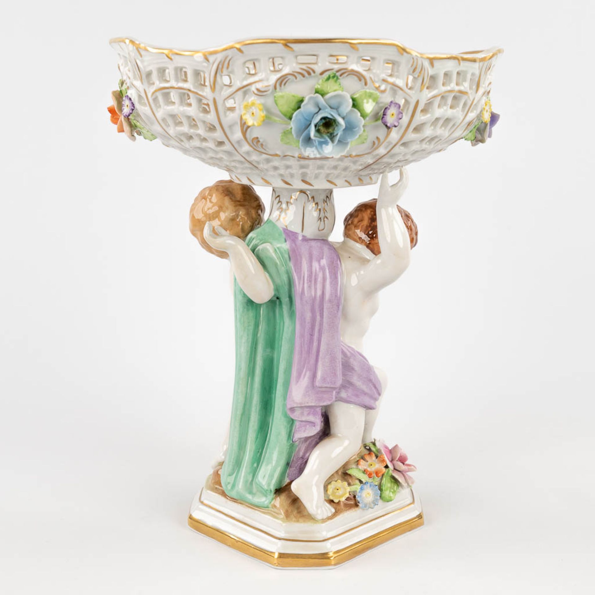 Plaue Schierholz 1817, a porcelain tazza decorated with boys holding up a basket. 20th C. (L: 19 x W - Image 7 of 22