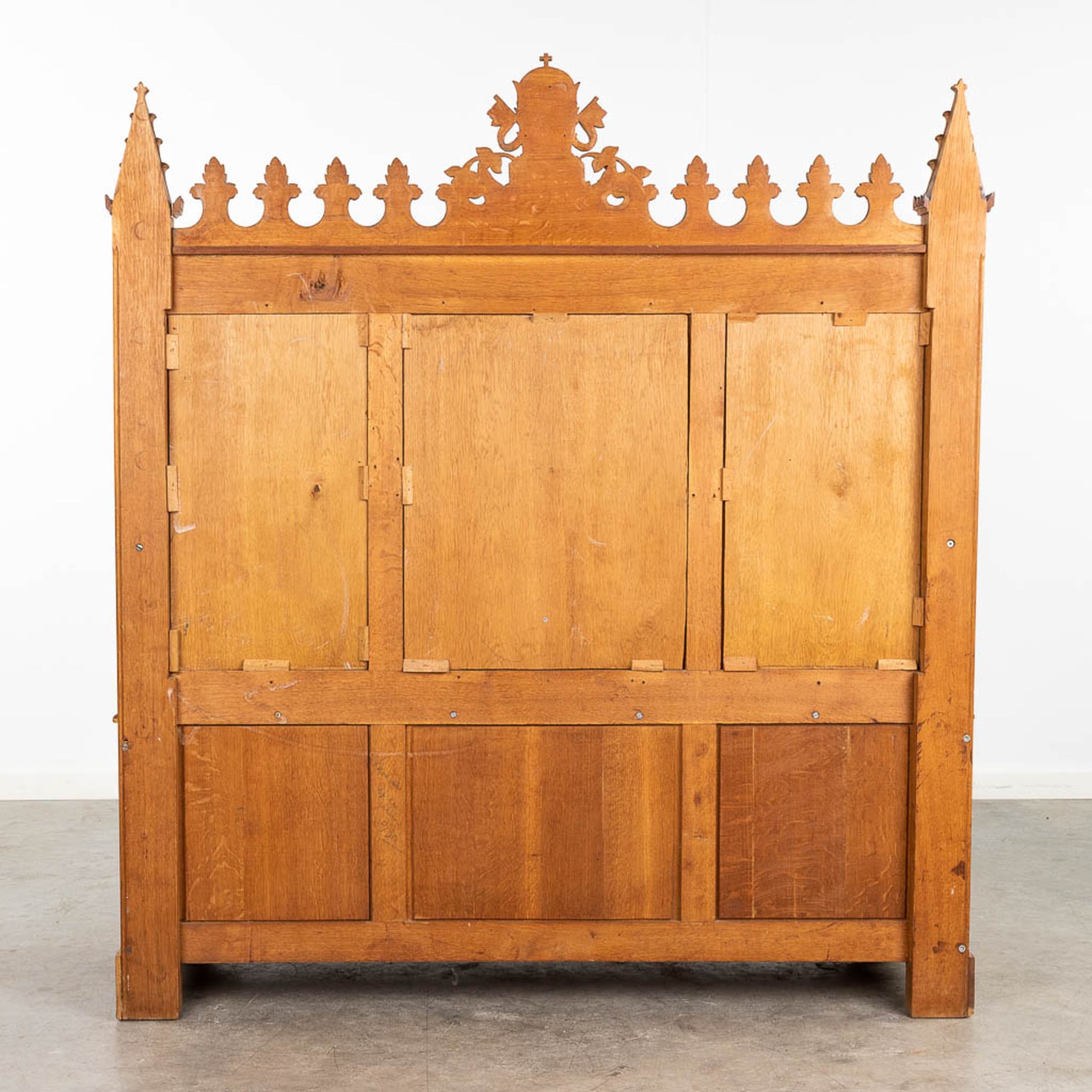A large and antique bench finished with wood sculptured in a Gothic Revival style. 20th century. (L: - Image 6 of 16