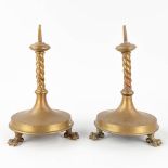 A pair of candlesticks made of bronze, standing on claw feet. 19th C. (H: 35 x D: 22 cm)