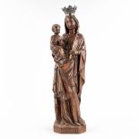 A figurine of Madonna with child, plaster with a silver crown. Circa 1900. (L: 16 x W: 19 x H: 66,5