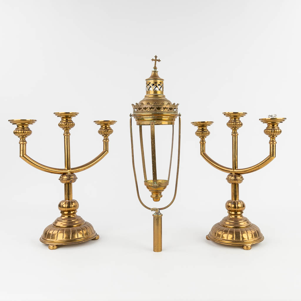 A pair of candlesticks and a procession lamp. 20th century. (H: 36 cm)