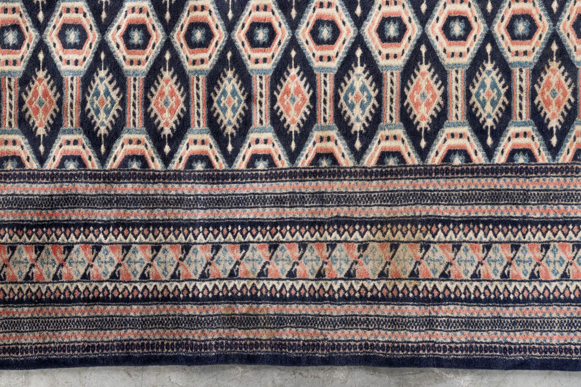 An Oriental hand-made carpet Buchara/Bokhara. (199 x 126 cm). (L: 199 x W: 126 cm) - Image 6 of 10