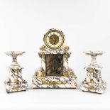 A three-piece garniture clock and side pieces, made of white and gray marble. Circa 1900. (L: 12 x W